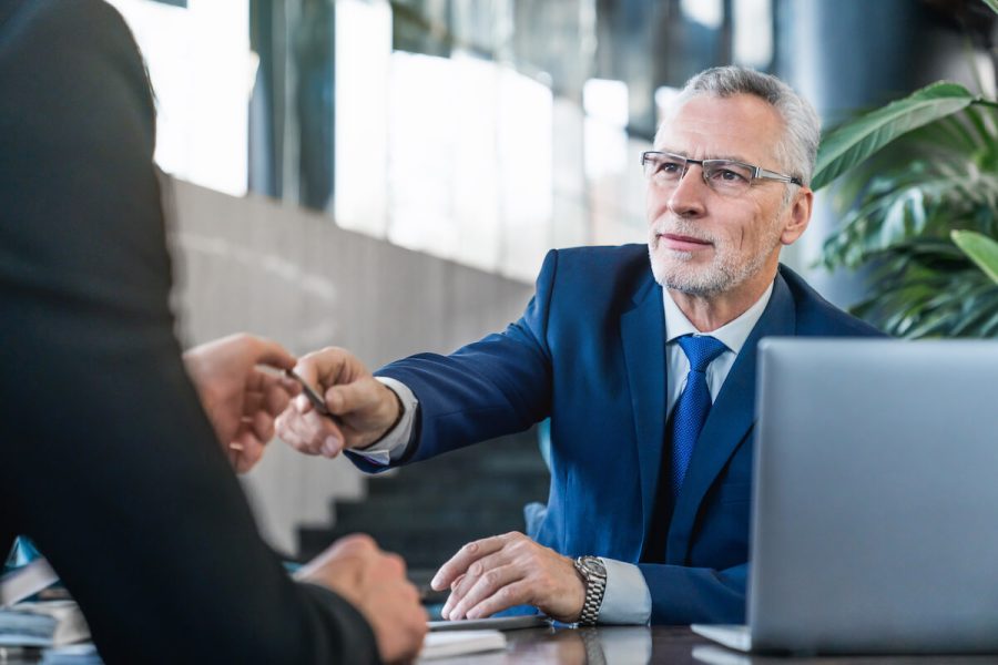 senior-and-young-businessmen-having-a-meeting-in-o-2025-01-09-05-41-56-utc.jpg