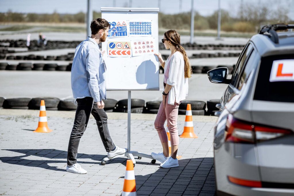driver-instructor-with-student-on-the-training-gro-3KYCGWX.jpg